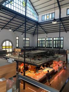 a large room with a bunch of food on display at NOTARIA-Apartamento y Estudio en casco antiguo, al lado de playa, Rambla y Monasterio, con acceso a terraza ajardinada in Sant Feliu de Guixols