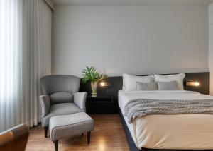 Cama ou camas em um quarto em Mercure Belo Horizonte Lourdes