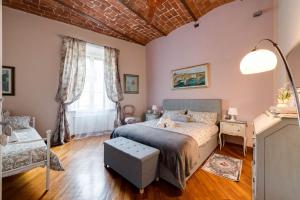 a bedroom with a bed and a window at eLLe Apartments Firenze in Florence
