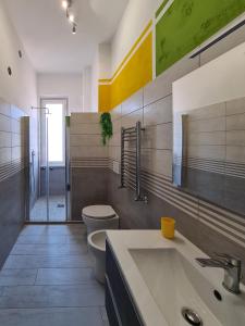 a bathroom with a sink and a toilet and a shower at APT Re di Roma in Rome