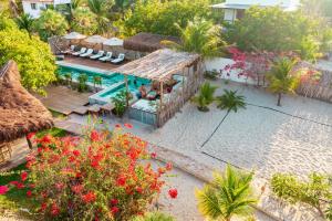 an aerial view of a resort with a swimming pool at La Cozinha Bungalow in Barra Grande