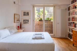 Cama o camas de una habitación en BnButler - Sagunto - Elegante e Luminoso Appartamento Immerso nel Verde