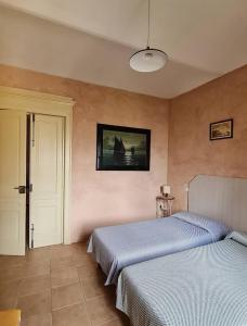 Posteľ alebo postele v izbe v ubytovaní A casa di Bianca