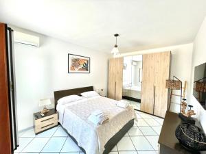 A bed or beds in a room at Rock House Villa