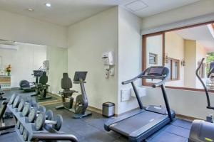 a gym with several treadmills and a treadmill at Casa Nicole Boutique Hotel in Puerto Vallarta