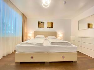 Posteľ alebo postele v izbe v ubytovaní Steiner Residences Vienna Vorgartenstrasse