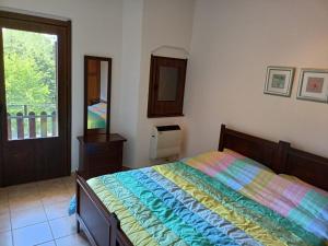 Кровать или кровати в номере Miralago Lorica