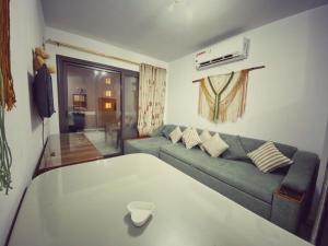 a living room with a couch and a table at One Bedroom Apartment - Porto Said chalet for rent بورتوسعيد بورتو سعيد in Port Said