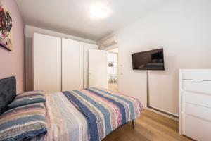 A bed or beds in a room at La Casa di Edo - WiFi Parking free Még 5 kép