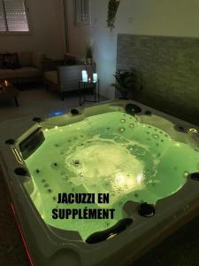 a jacuzzi tub in a living room at App T2 a Montpellier in Montpellier