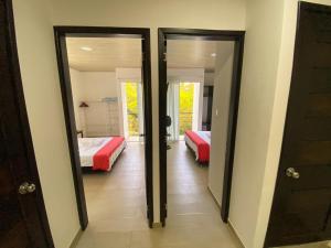 Voodi või voodid majutusasutuse Aparta-Hotel LENEMBERGER toas