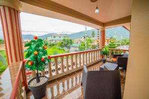 a balcony with a christmas tree and a view at Willy's house in Jarabacoa