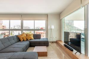 a living room with a couch and a large window at Paradero Rental B75 Vistas al Mar in Calpe
