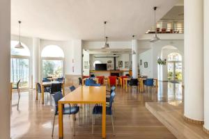 a dining room with tables and chairs in a building at Paradero Rental B75 Vistas al Mar in Calpe