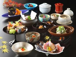 a group of bowls and plates of food on a table at Yoshimatsu in Hakone