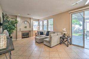 a living room with a couch and a fireplace at New Home Hot Tub, Grill, Games, 11 Mi to Strip! in Las Vegas