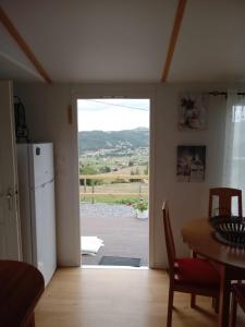 a kitchen with a door open to a patio at Casa del cristo in Solórzano +3 photos