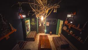 a room with a hallway with a chandelier at Petra Pottery Hostel in Wadi Musa