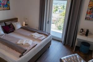 Posteľ alebo postele v izbe v ubytovaní Rooms21