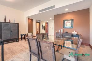 a dining room and living room with a table and chairs at Be relaxed at this 2BR apt at Casa De Campo in Buena Vista
