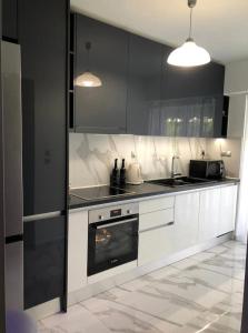 A kitchen or kitchenette at Lovely Faliro Apartment next to the sea.