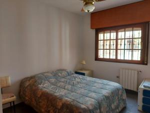 En eller flere senge i et værelse på Casa hermosa cómoda en barrio tranquilo