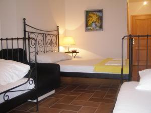 a bedroom with two bunk beds and a lamp at Palastura Apartments in Ulcinj