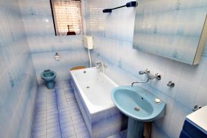 a bathroom with a sink and a toilet at Apartments with a parking space Malinska (Krk) - 5284 in Malinska +25 photos