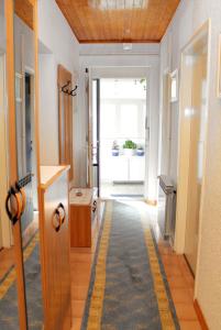 a hallway with a yellow stripe on the floor at Apartments with a parking space Selce, Crikvenica - 5495 in Selce