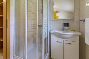 a bathroom with a shower and a sink at Apartments by the sea Selce, Crikvenica - 5367 in Selce