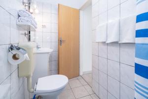 a bathroom with a toilet and a sink at Apartment Punat 5351b in Punat