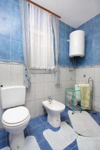 Et badeværelse på Apartment Punat 5350b