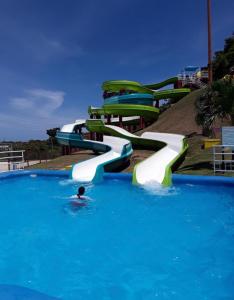 a person swimming in a water slide at a water park at Paradise Island in Isabela