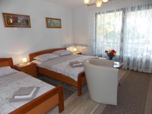 Postel nebo postele na pokoji v ubytování Apartments with a parking space Malinska (Krk) - 5353 + 39 fotografií