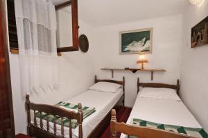 Posteľ alebo postele v izbe v ubytovaní Apartment Selce 5531b