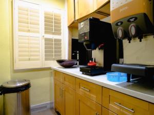 a kitchen with a counter with a coffee maker at Elite Inn in San Francisco