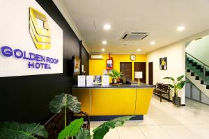 a lobby of a hospital with a yellow reception counter at Golden Roof Hotel Falim Ipoh in Ipoh