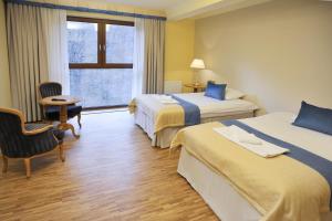 Łóżko lub łóżka w pokoju w obiekcie Hotel Mir-Jan SPA