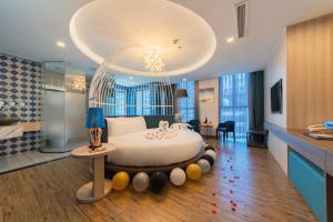 a bedroom with a large bed in a room at Aaron Hotel in Nha Trang