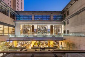 a view of the lobby of a building at Millennium Hotel Wuxi in Wuxi