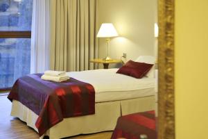 Łóżko lub łóżka w pokoju w obiekcie Hotel Mir-Jan SPA