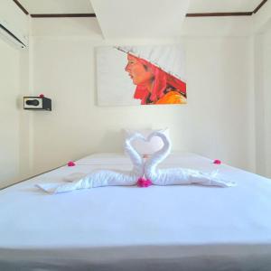Putra Boyan Cottages客房内的一张或多张床位