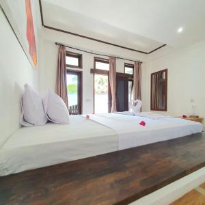 Putra Boyan Cottages客房内的一张或多张床位