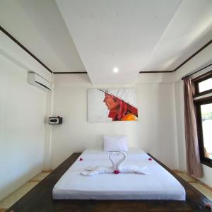 Putra Boyan Cottages客房内的一张或多张床位