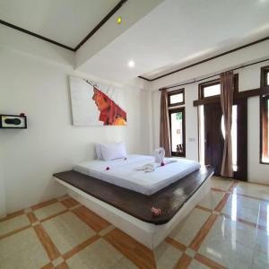 Putra Boyan Cottages客房内的一张或多张床位