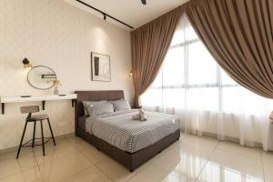 a bedroom with a bed and a desk and a window at Conezion Residence Putrajaya 3BR6Pax IOI City Mall in Putrajaya