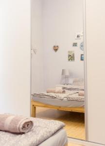 Posteľ alebo postele v izbe v ubytovaní Aurora Apartments