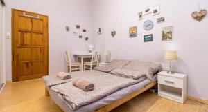 Posteľ alebo postele v izbe v ubytovaní Aurora Apartments