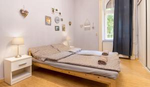 Posteľ alebo postele v izbe v ubytovaní Aurora Apartments