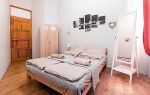 Posteľ alebo postele v izbe v ubytovaní Aurora Apartments